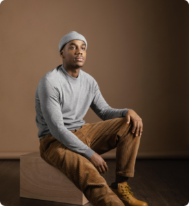 portrait-male-wearing-cap-sitting