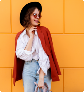pretty-brunette-girl-stylish-hat-posing-yellow-wall